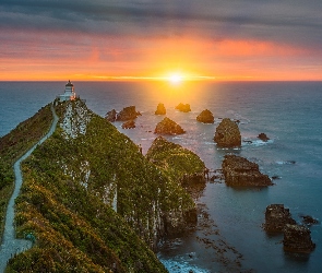 Wschód słońca, Morze, Region Otago, Skały, Nugget Point Fighthouse, Nowa Zelandia, Latarnia morska