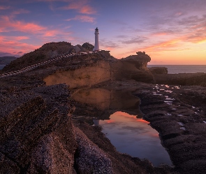 Castlepoint, Zachód słońca, Skały, Nowa Zelandia, Castlepoint Lighthouse, Morze, Latarnia morska