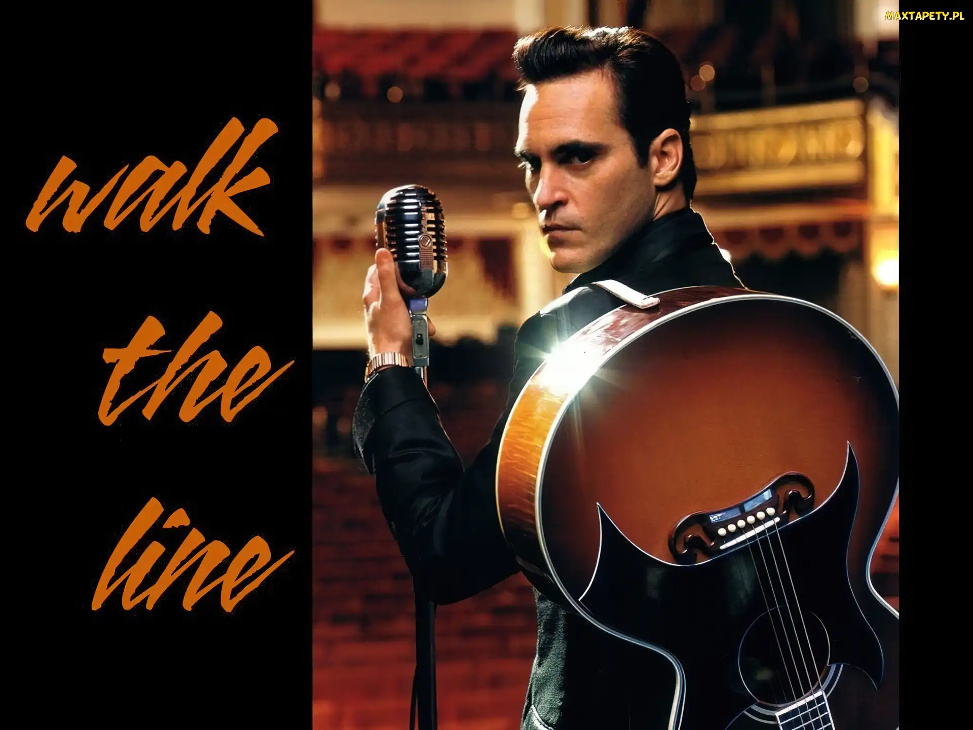 Joaquin Phoenix, gitara, mikrofon